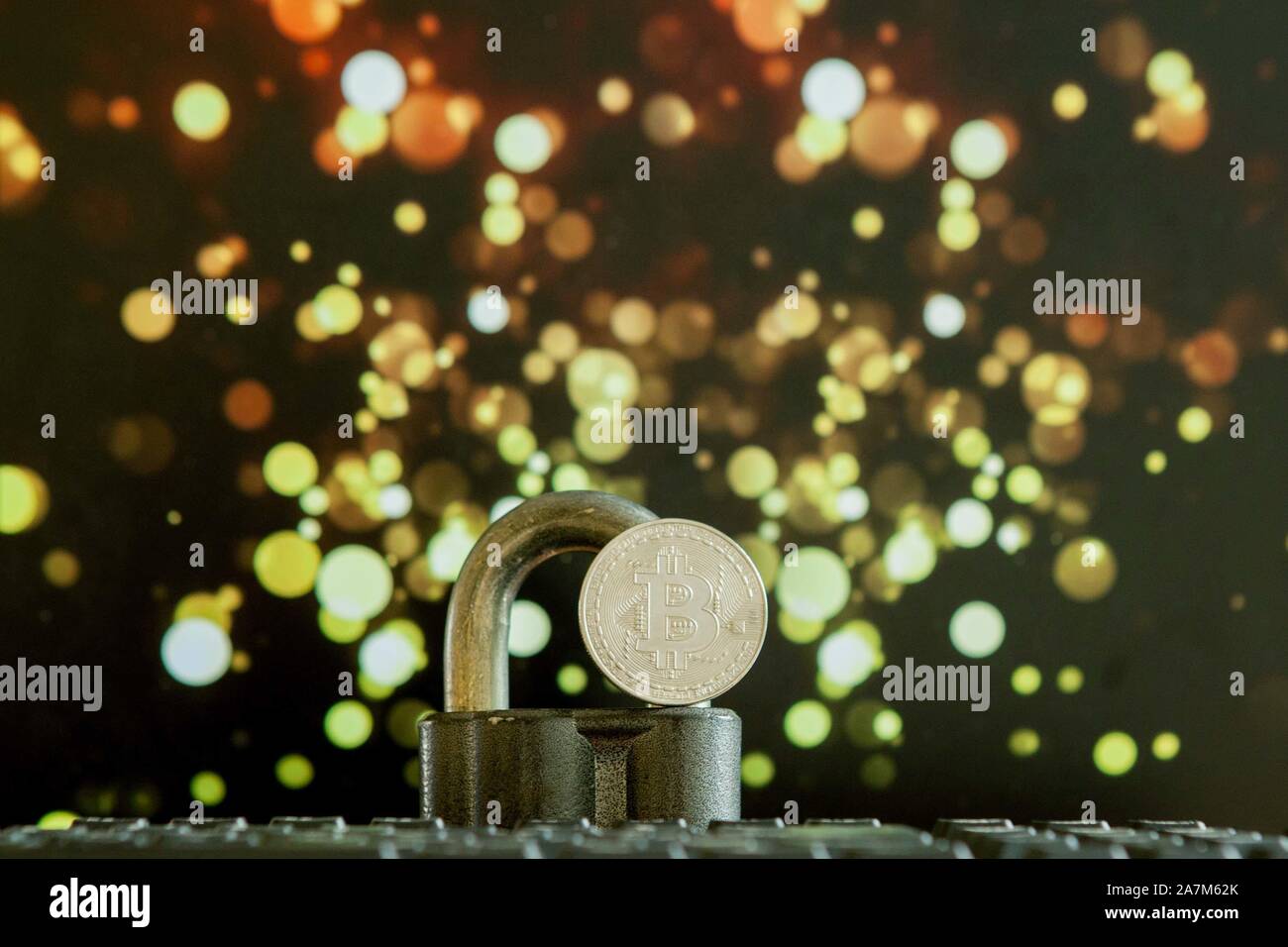 Bitcoin currency on keyboard computer on bokee background.Virtual cryptocurrency concept Stock Photo