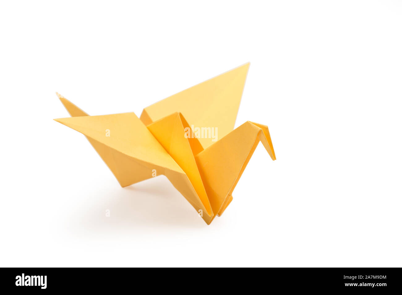 Origami bird isolated with clipping path. Japanese folded paper swan. Peace and hope symbol Stock Photo