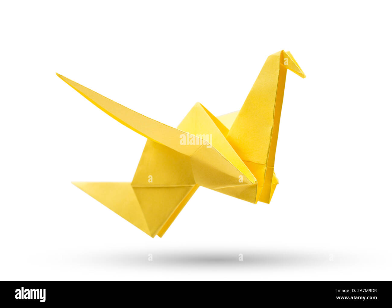 Origami flying bird isolated with clipping path. Japanese folded paper swan. Peace and hope symbol Stock Photo