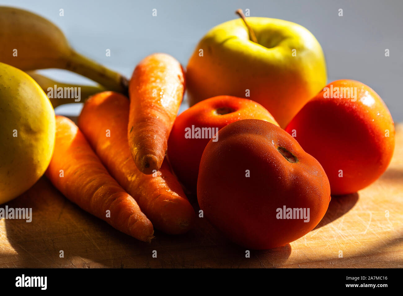 Fresh Mixed Fruits With Vegetables Healthy Food, on colorful blurry background. Stock Photo