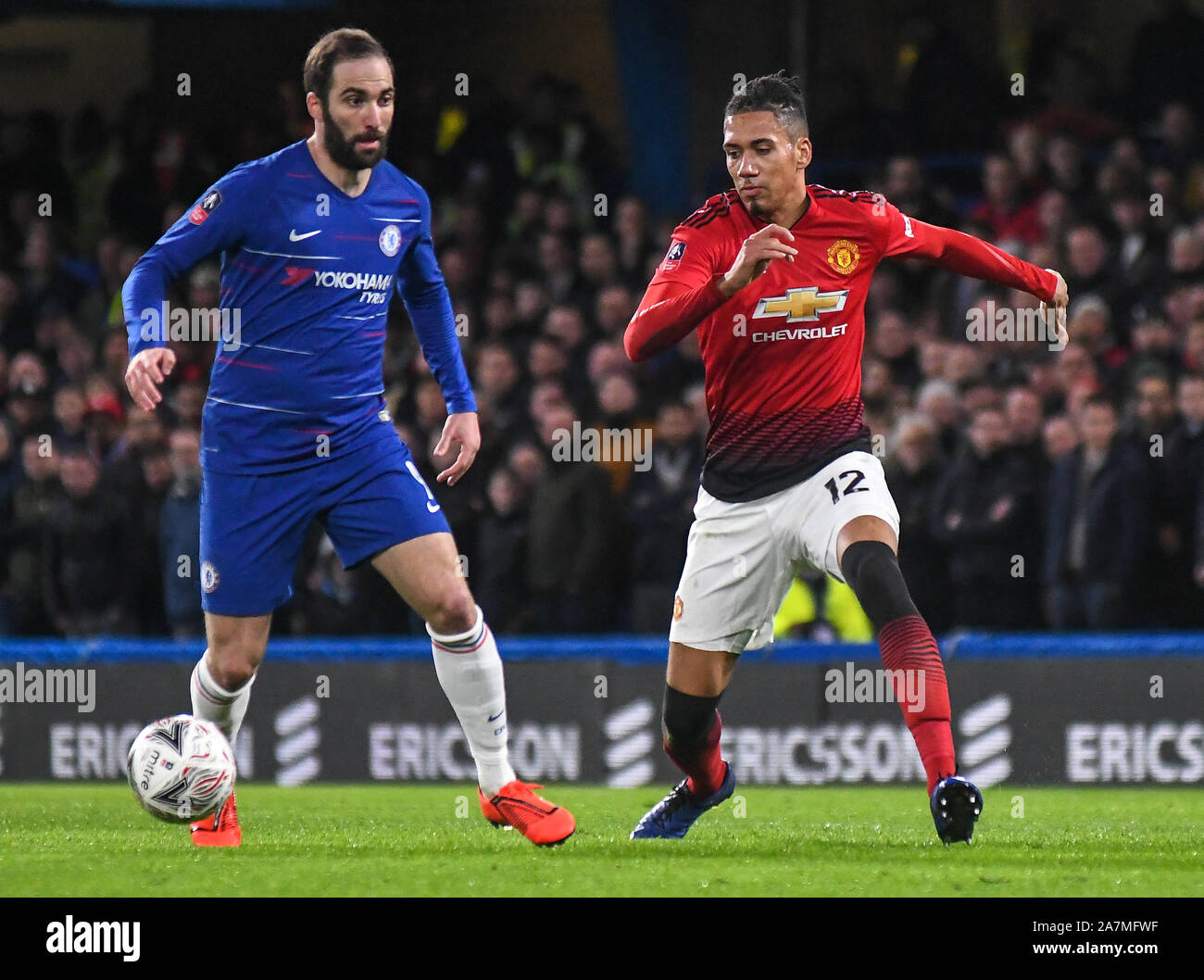 LONDON, ENGLAND - FEBRUARY 18, 2019: Gonzalo Higuain of Chelsea and Chris Smalling of Manchester pictured during the 2018/19 FA Cup Fifth Round game between Chelsea FC and Manchester United at Stamford Bridge. Stock Photo