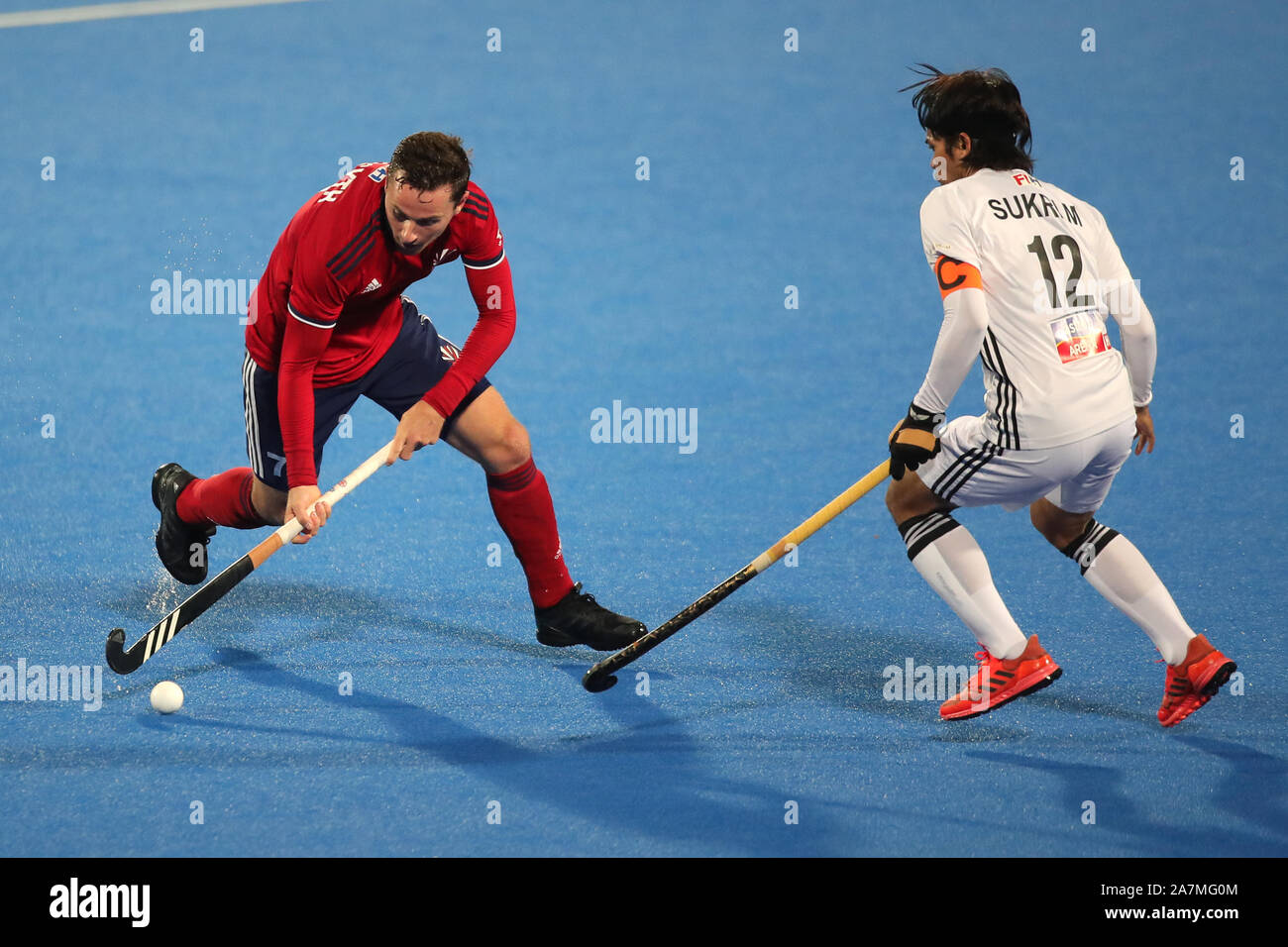Great Britain's Alan Forsyth (left) and Malaysia's Sukri Mutalib during the FIH Hockey Olympic Qualifier at Lee Valley Hockey and Tennis Centre, London. Stock Photo