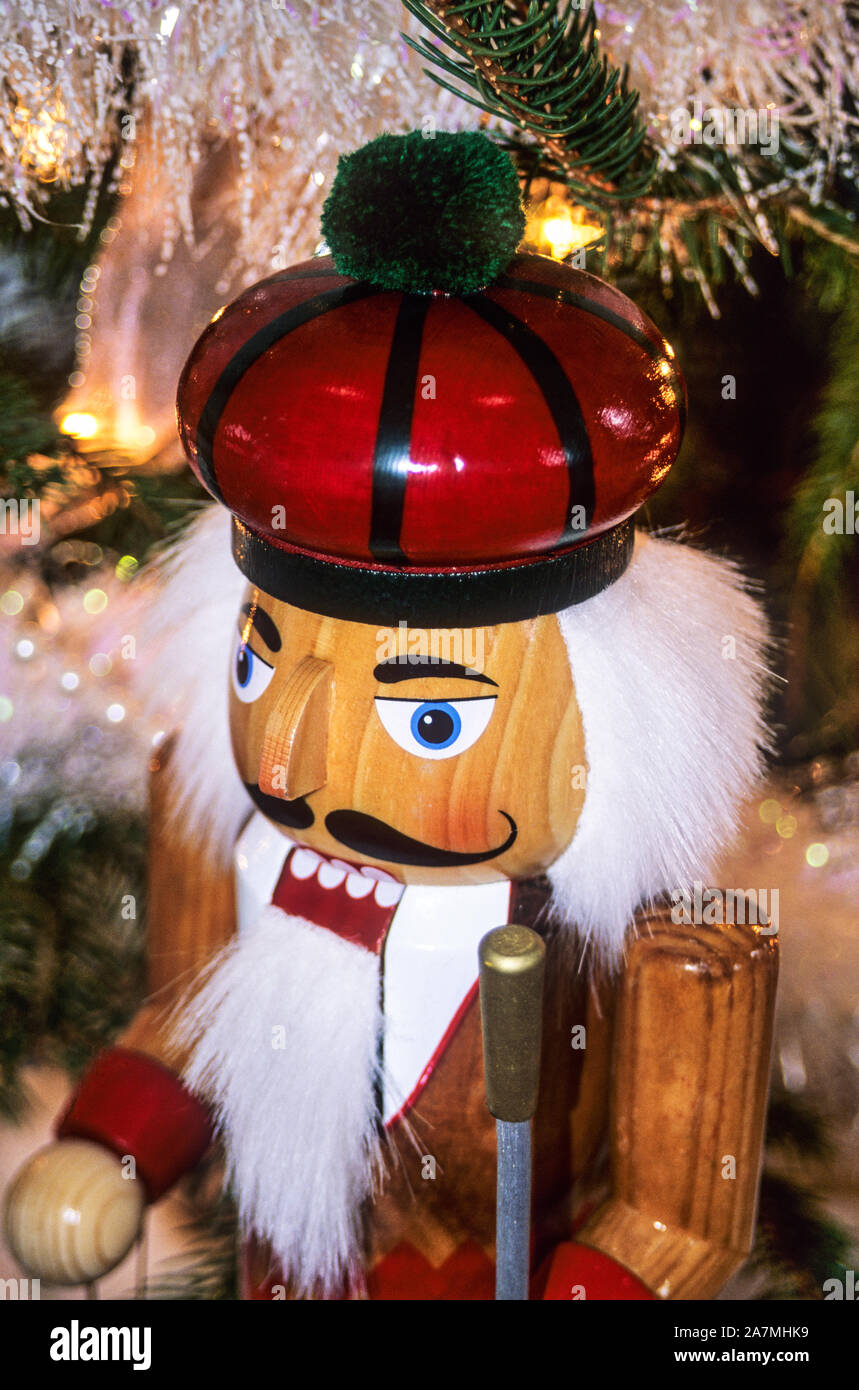 Close up Christmas vintage red Nutcracker under a Christmas tree, New Jersey, USA, Abstract nut cracker, Christmass Stock Photo