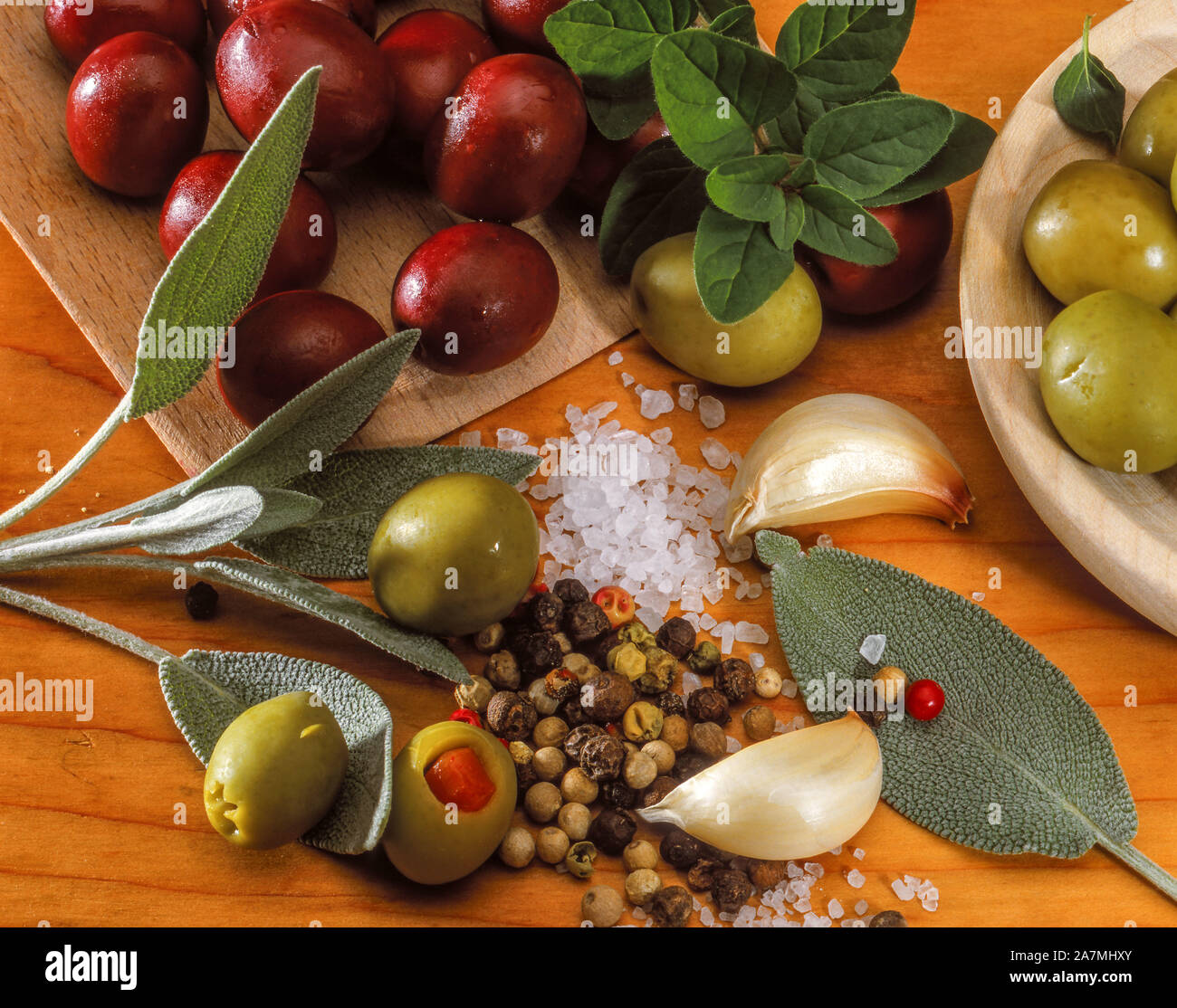 Different varieties of olives with herbs Stock Photo Alamy