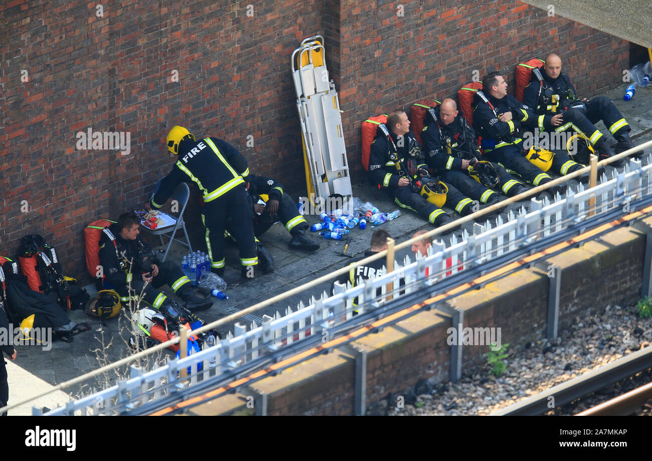 Grenfell tower firefighters exhausted hi-res stock photography and ...