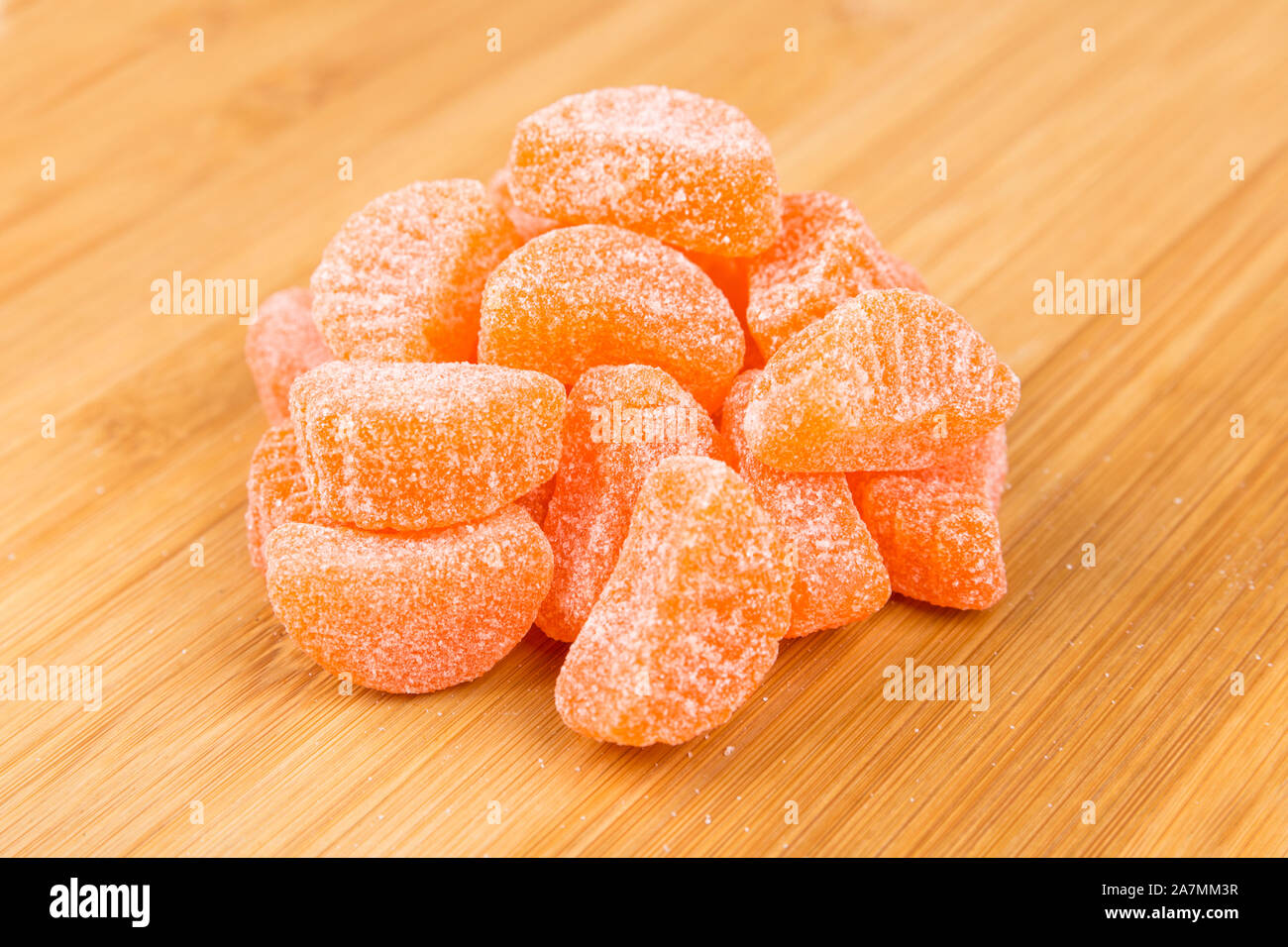 Handful of sugar coated candy orange slices Stock Photo Alamy