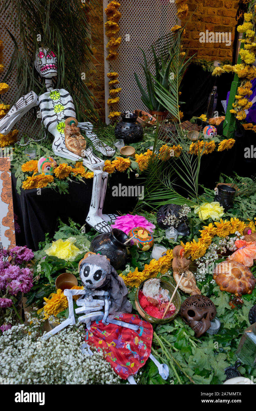 Traditional Day of the Dead (Dia de los Muertos) altar and banners in a ...