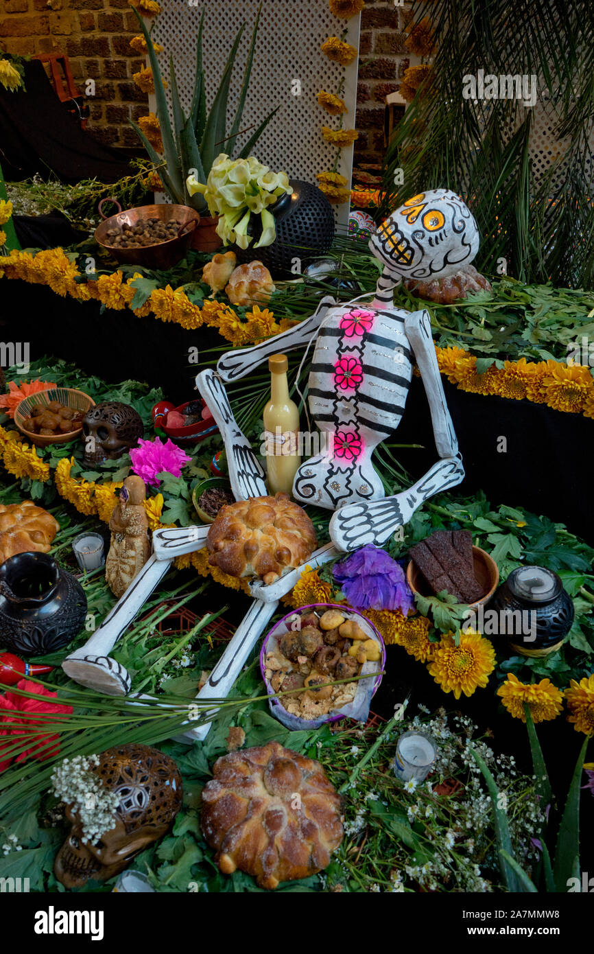 Traditional Day of the Dead (Dia de los Muertos) altar and banners in a ...