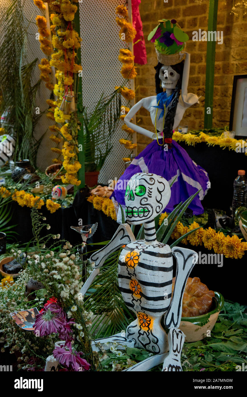 Traditional Day of the Dead (Dia de los Muertos) altar and banners in a ...