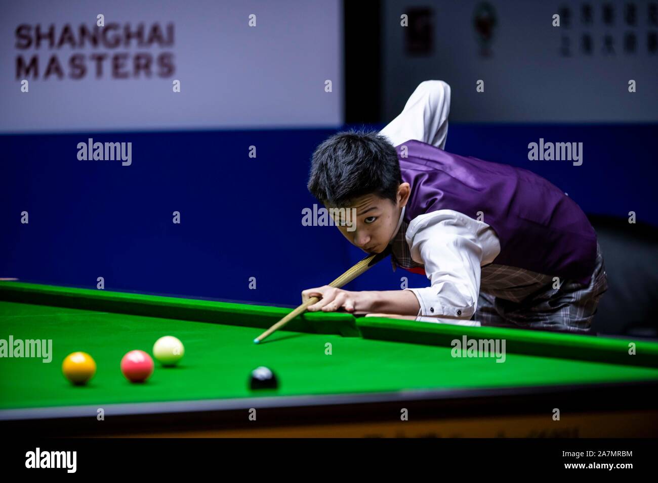 Chinese professional snooker player Wu Yize plays a shot at the Round 1 ...