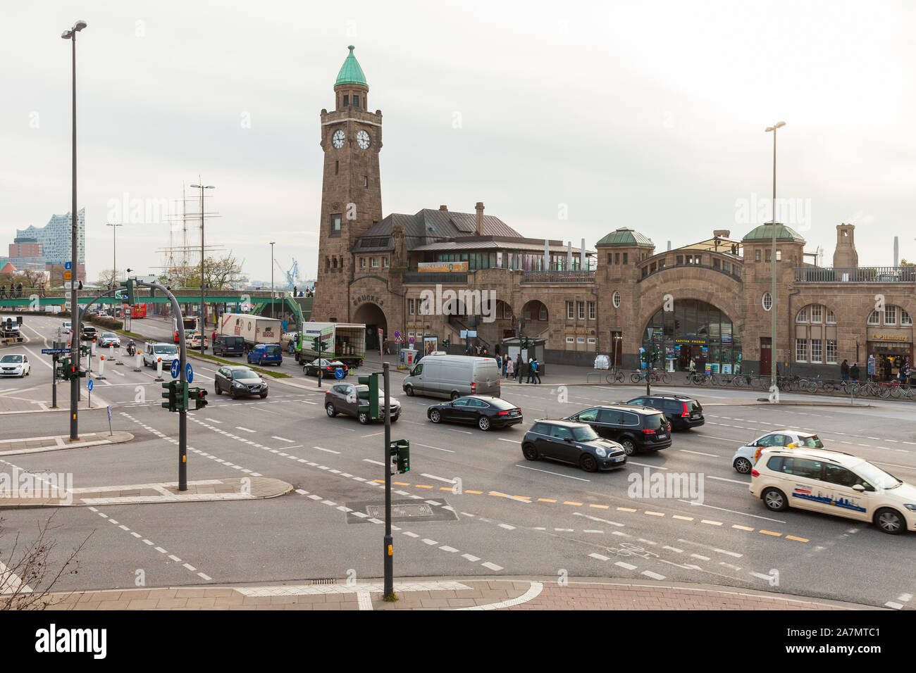 Hamburg, Germany - November 30, 2018: Port of Hamburg view with the Clocktower at Landungsbruecken at daytime, ordinary people and cars are on the str Stock Photo
