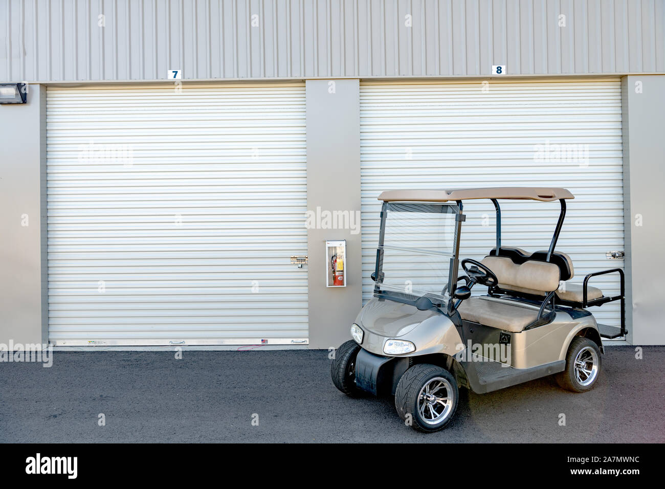 Garage Doors Beyond A Electric Vehicle Used To Move People Stock