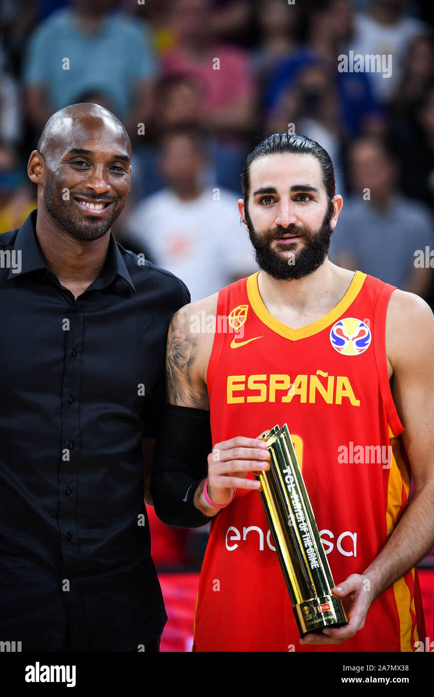 Retired American basketball player Kobe Bryant, left, awards the MVP trophy to Spanish professional basketball player Ricky Rubio, right, in Beijing, Stock Photo
