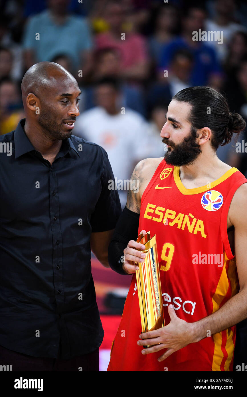 Retired American basketball player Kobe Bryant, left, awards the MVP trophy to Spanish professional basketball player Ricky Rubio, right, in Beijing, Stock Photo