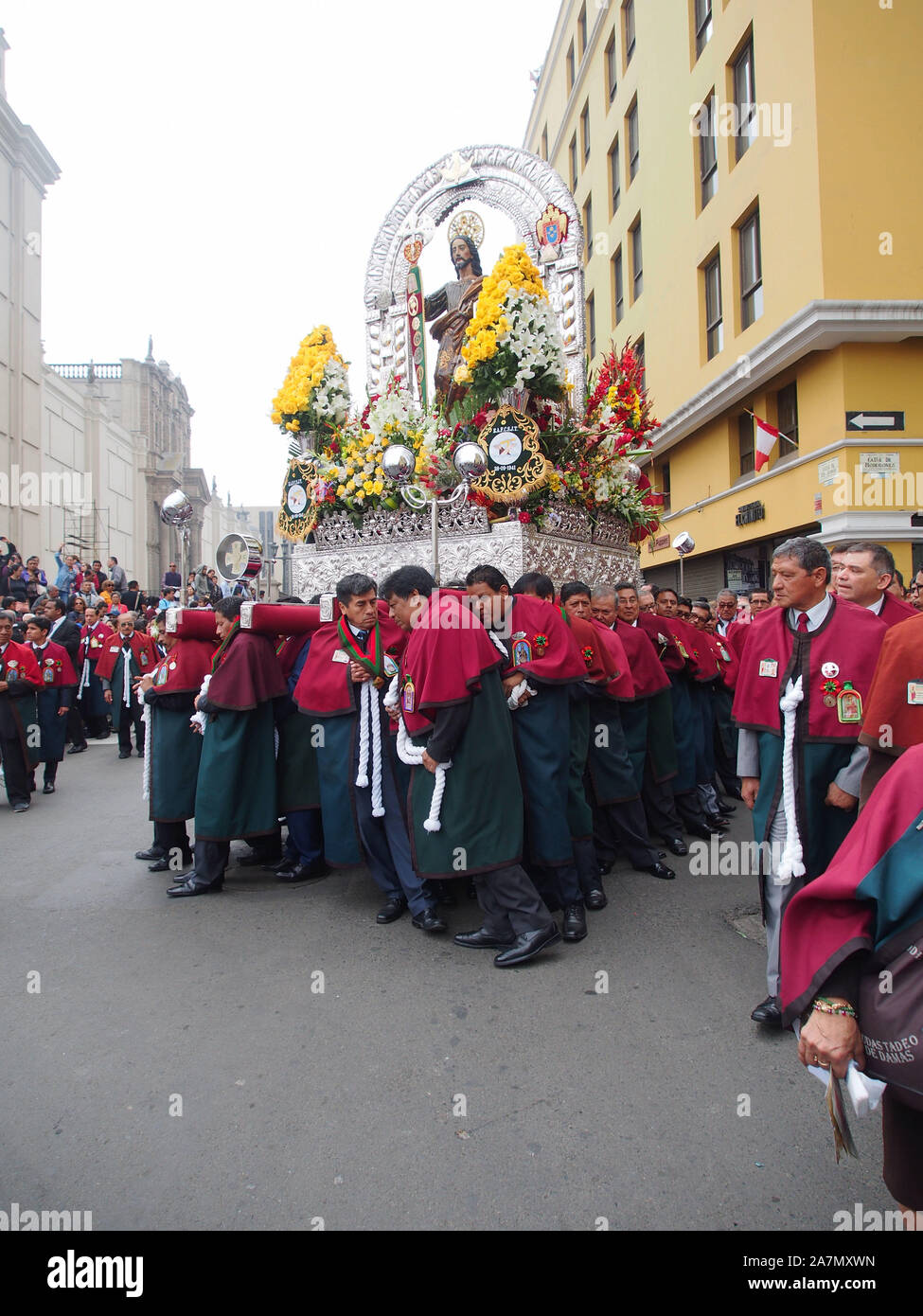 Penitents carrying a religious altar when participating in the procession and parade for Jude the Apostle (Saint Jude Thaddeus) in Lima downtown. Stock Photo