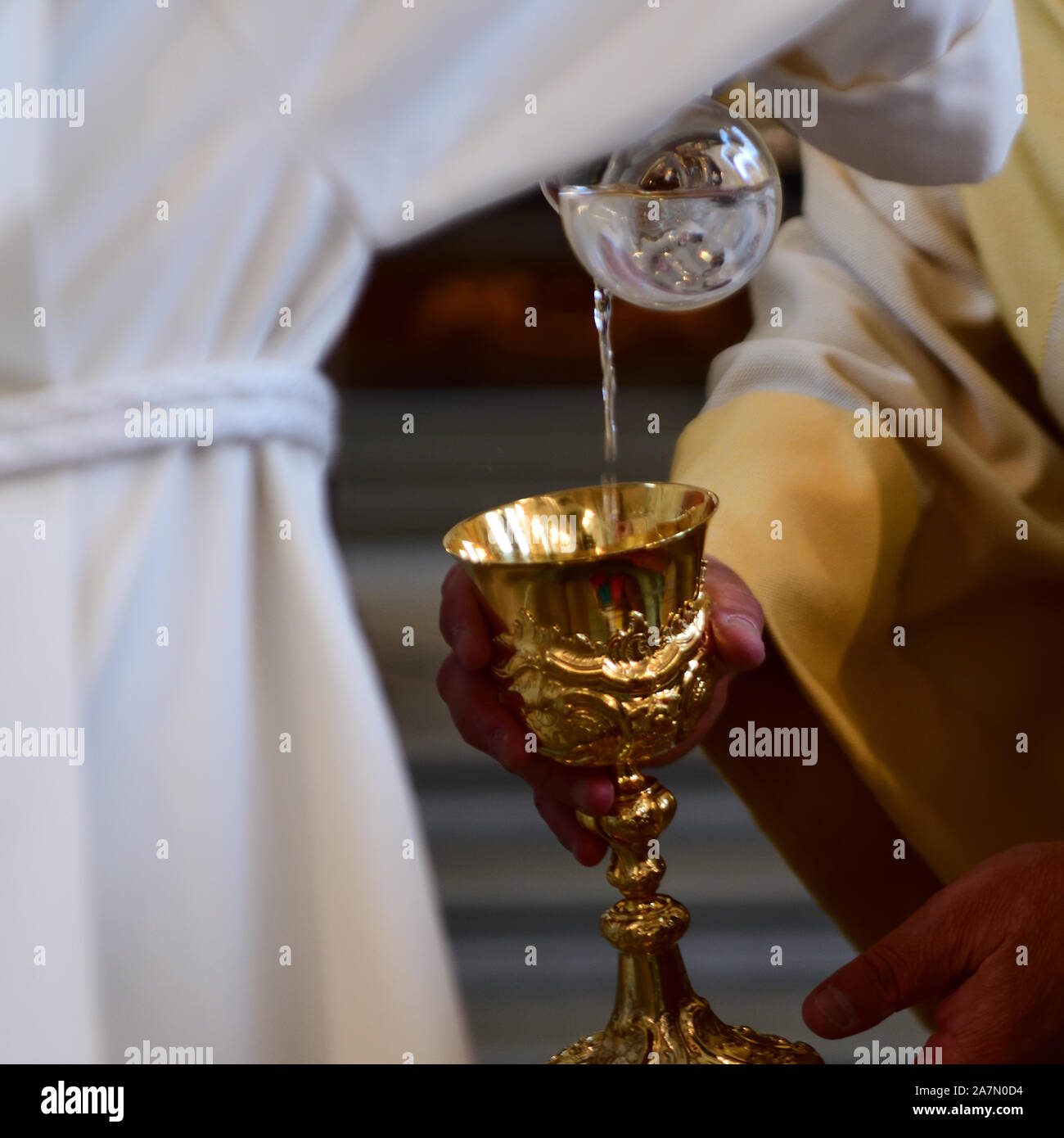 Catholic Altar Boy Water in Chalice Stock Photo