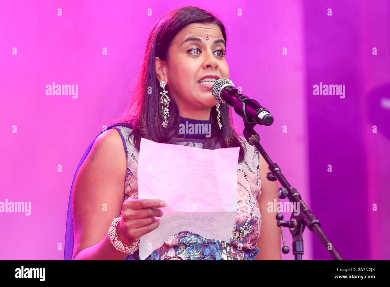 Pooja Shah speaks during the Diwali celebrations in London. Pooja Shah is a British actress, filmmaker and model of Kenyan-Asian descent. She is known for her role as Kareena Ferreira in the popular UK soap opera EastEnders. Pooja Shah works with her husband directing and writing short films and has won three film awards for them Stock Photo