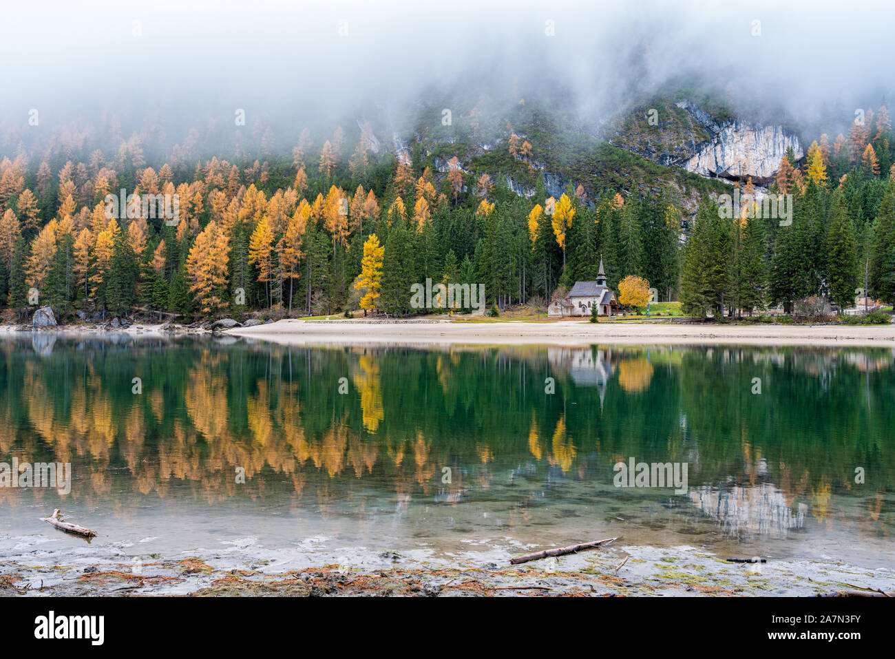 Foggy autumn morning at Lake Braies, Province of Bolzano, Trentino Alto Adige, Italy. Stock Photo