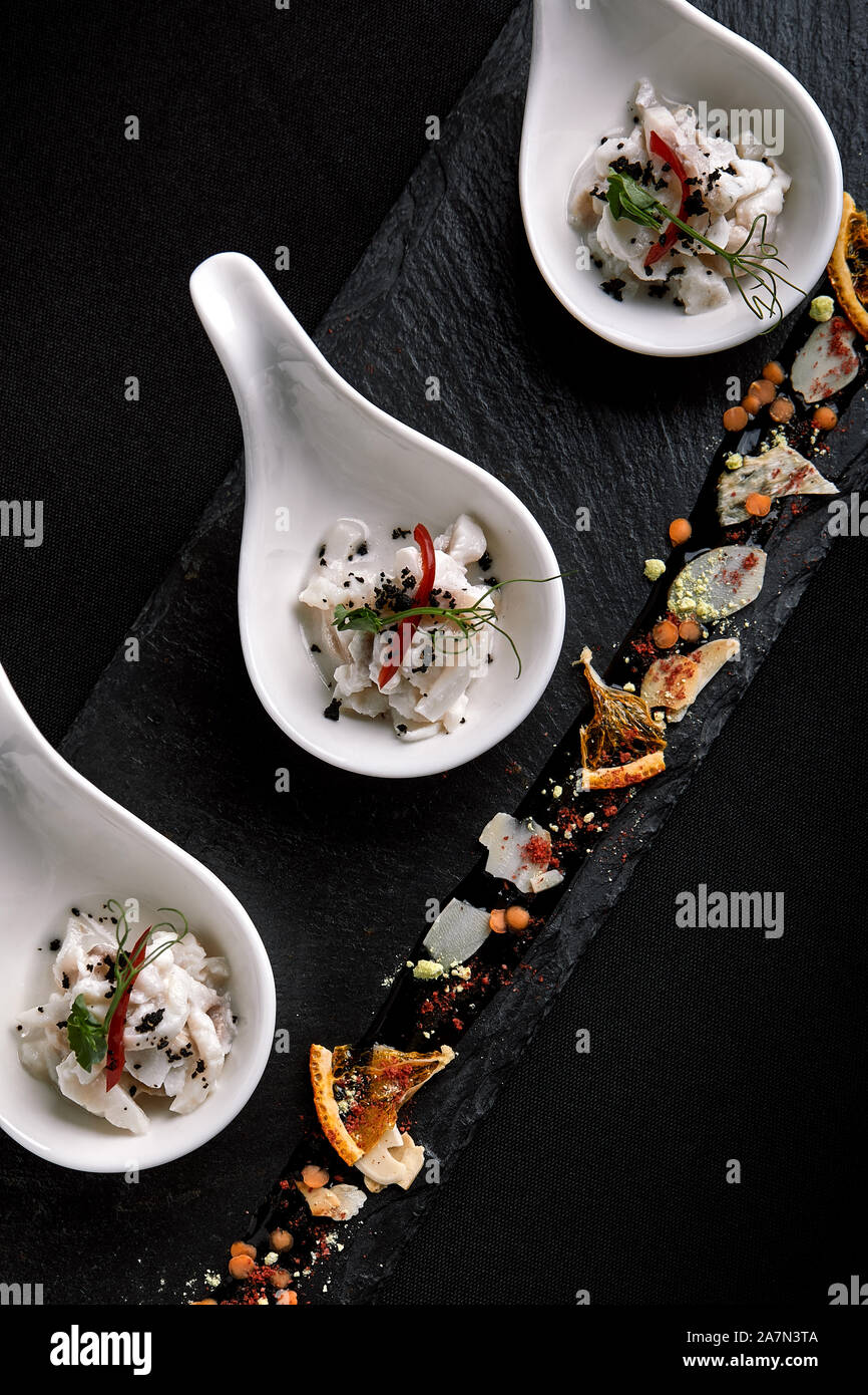 Sea bass ceviche mini portions served in beautiful Chinese spoons on a