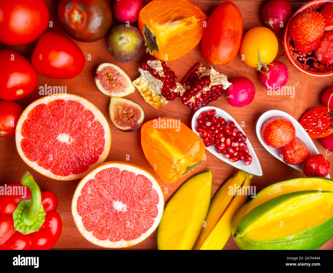 fresh red, orange, yellow fruit and vegetables rich in antioxidants, fiber, alfa carotene