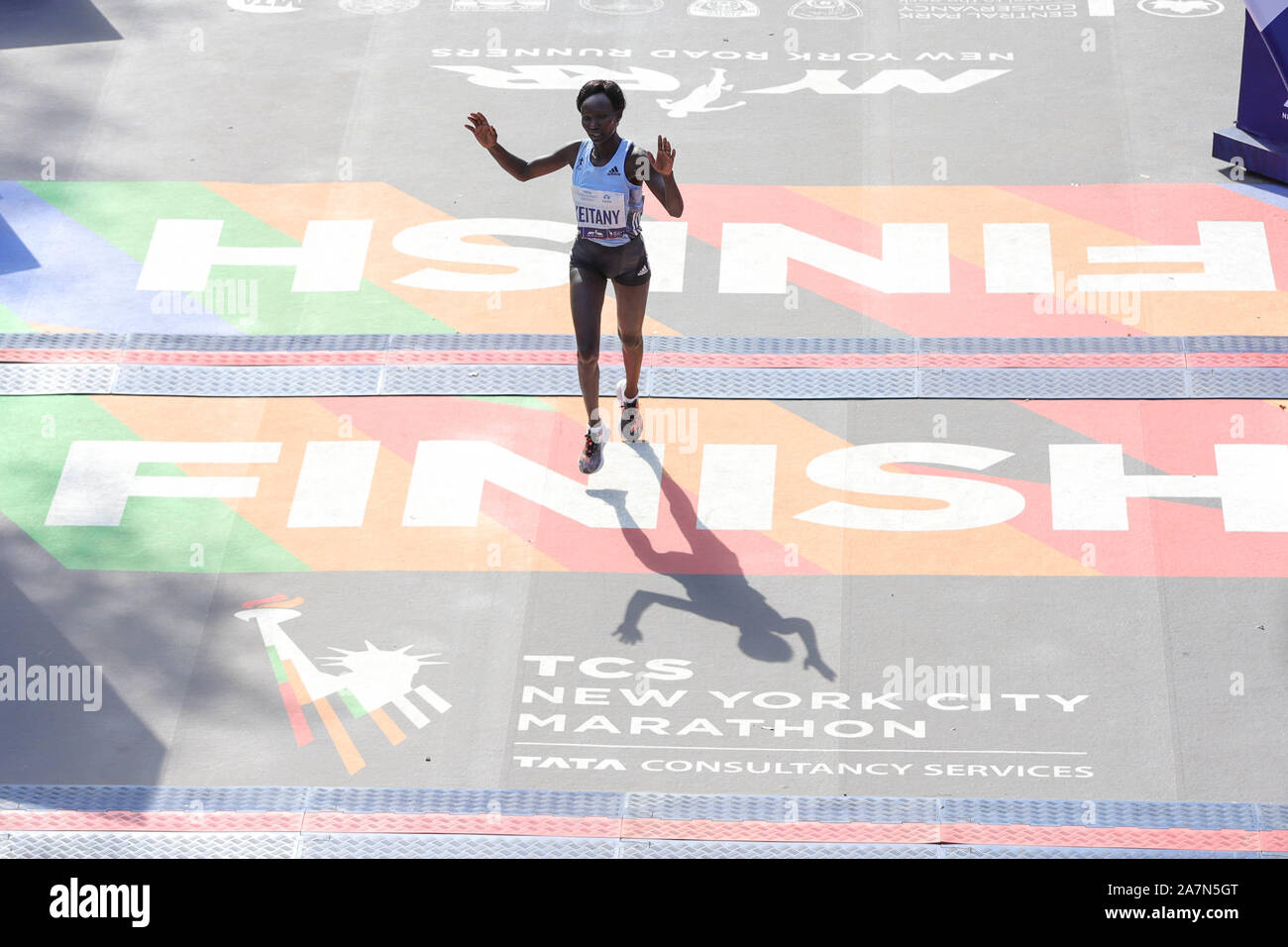 New York, New York, USA. 3rd Nov, 2019. Mary Keitany of Kenya arrives in second place during the 2019 TCS New York City Marathon in New York on November 3, 2019. - Geoffrey Kamworor and Joyciline Jepkosgei sealed a double victory for Kenya at the New York Marathon on Sunday, storming to convincing wins in the men's and women's races at the annual showpiece. Kamworor, the 2017 New York champion, pulled clear in the closing stages to take the tape in Central Park 2hr 8min 13sec. Credit: William Volcov/ZUMA Wire/Alamy Live News Stock Photo