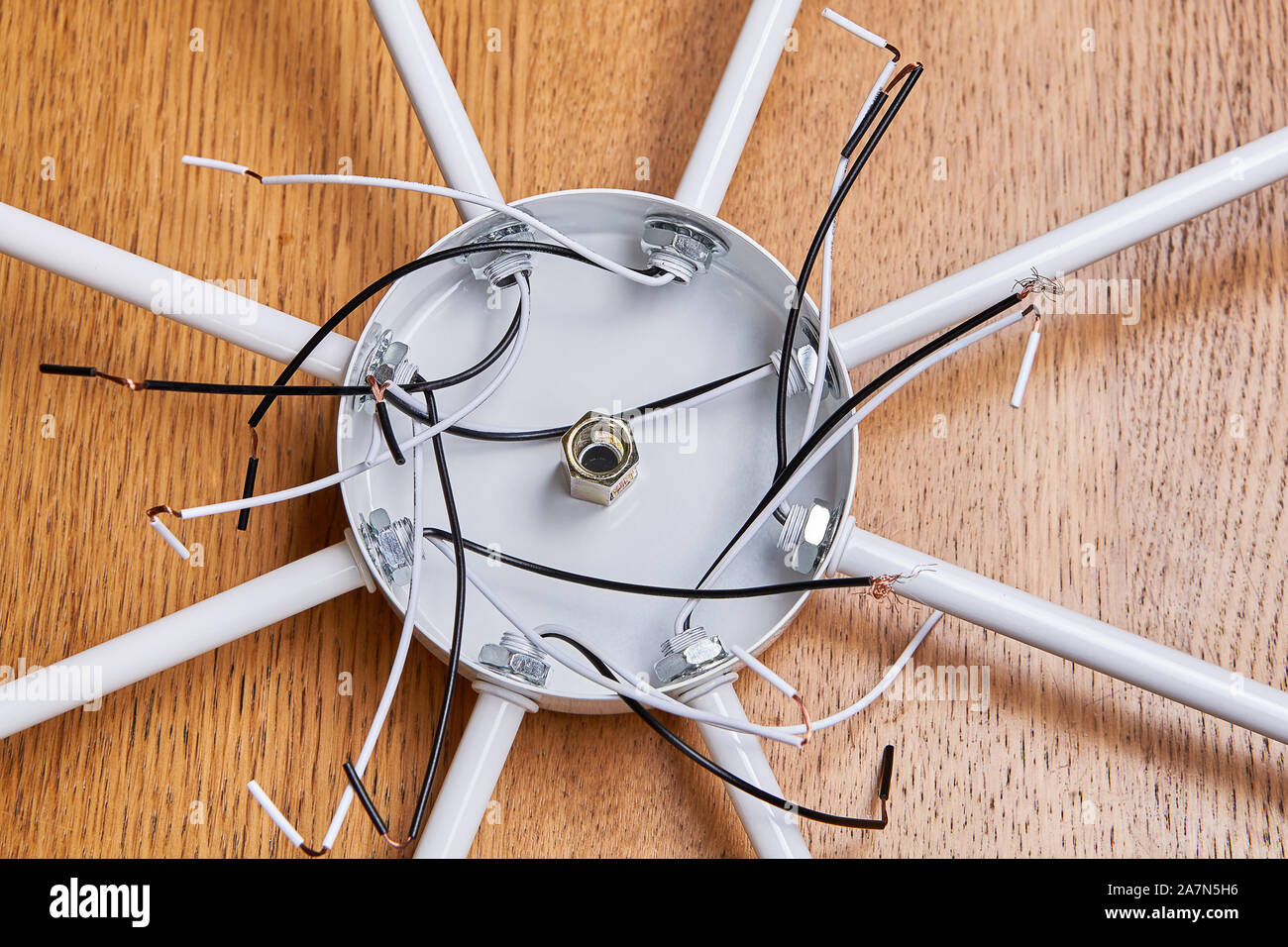 Wiring of a modern ceiling chandelier for LED light bulbs. Cables of