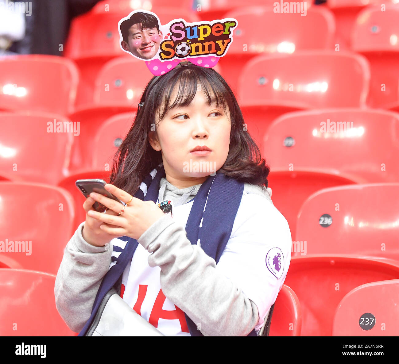 LONDON, ENGLAND - MARCH 2, 2019: Fans pictured in the stands ahead of the 2018/19 Premier League game between Tottenham Hotspur and Arsenal FC at Wembley Stadium. Stock Photo