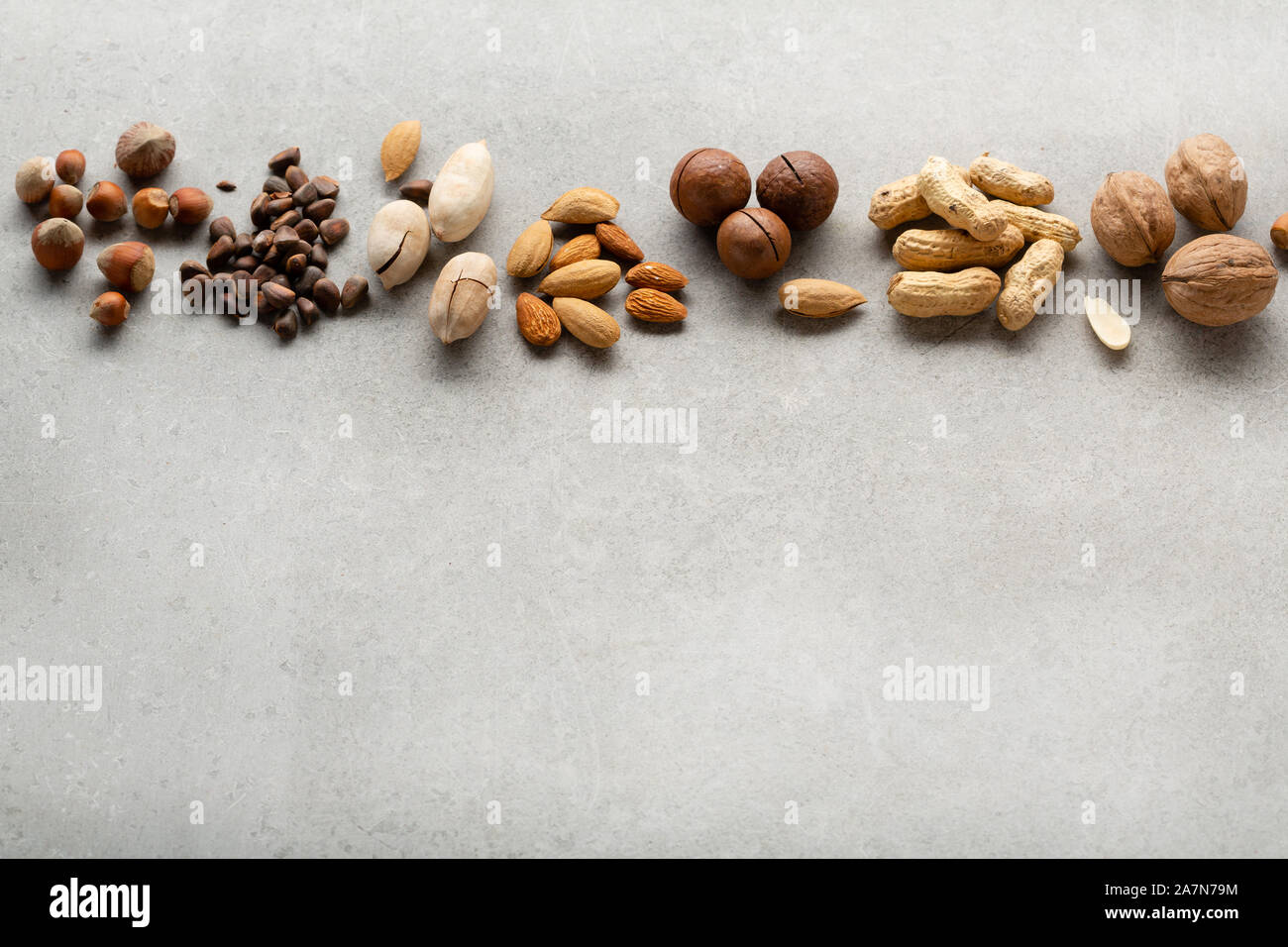 Organic nuts mix on gray background and copy space Stock Photo