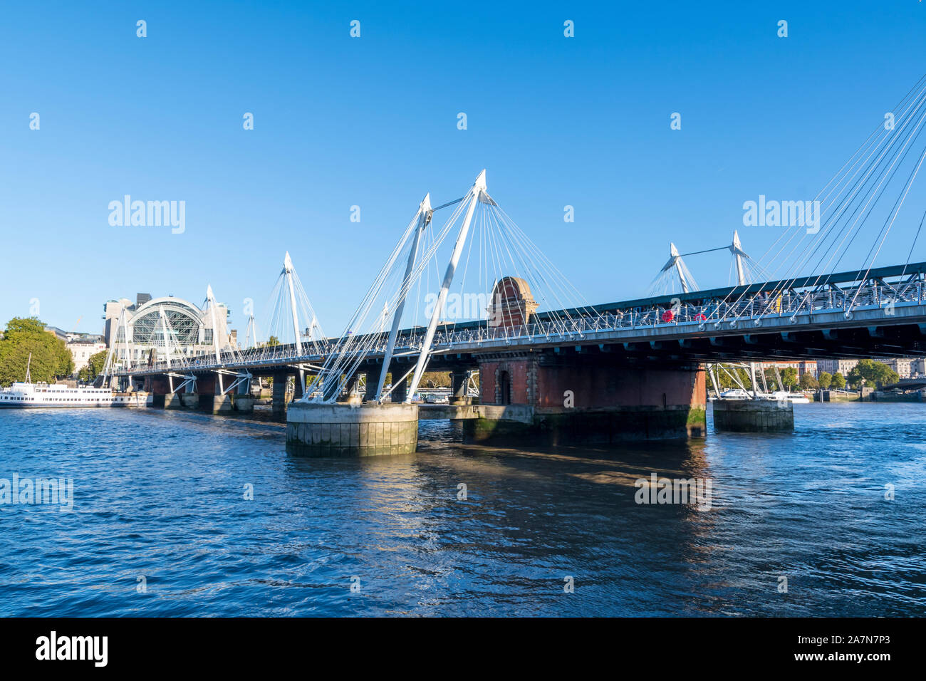 The Hungerford and Golden Jubilee Bridges across the Thames Stock Photo