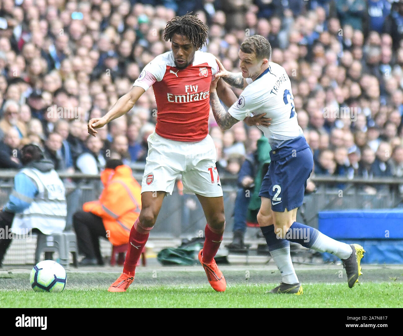 LONDON, ENGLAND - MARCH 2, 2019: Alex Iwobi of Arsenal and Kieran Trippier of Tottenham pictured during the 2018/19 Premier League game between Tottenham Hotspur and Arsenal FC at Wembley Stadium. Stock Photo