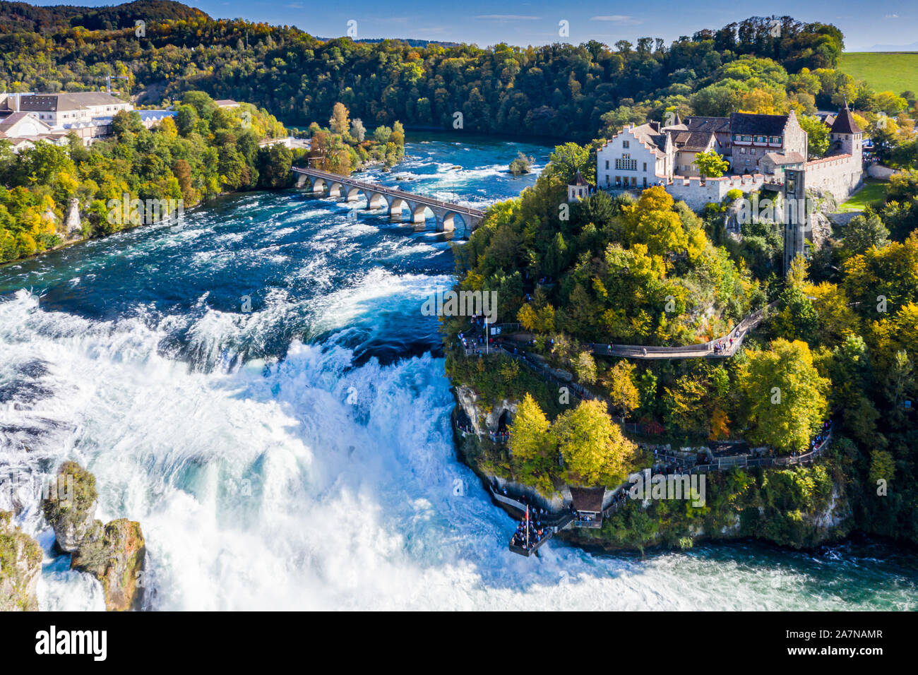 Rhine Falls or Rheinfall, Switzerland panoramic aerial view. Tourist boat in waterfall. Bridge and border between the cantons Schaffhausen and Zurich. Stock Photo