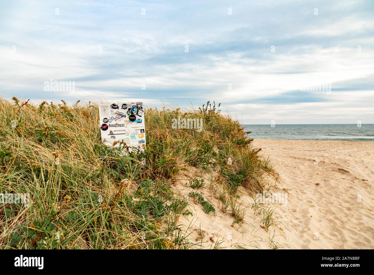 Stickers all over a sign at an Amagansett beach in Amagansett, ny Stock