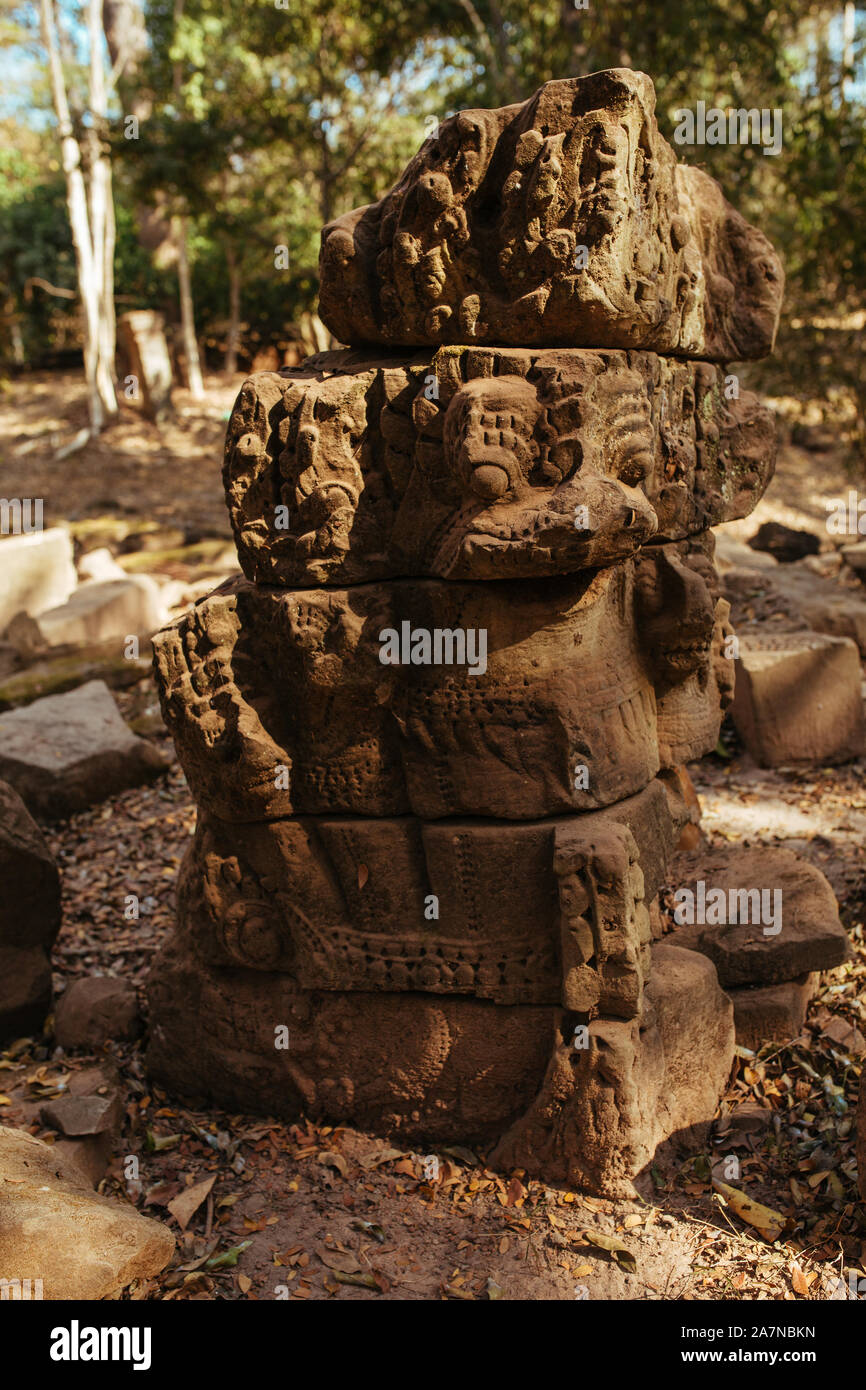 Stone statues of faces in Cambodian Angkor Wat Temple near Siem Reap city in Asia Stock Photo