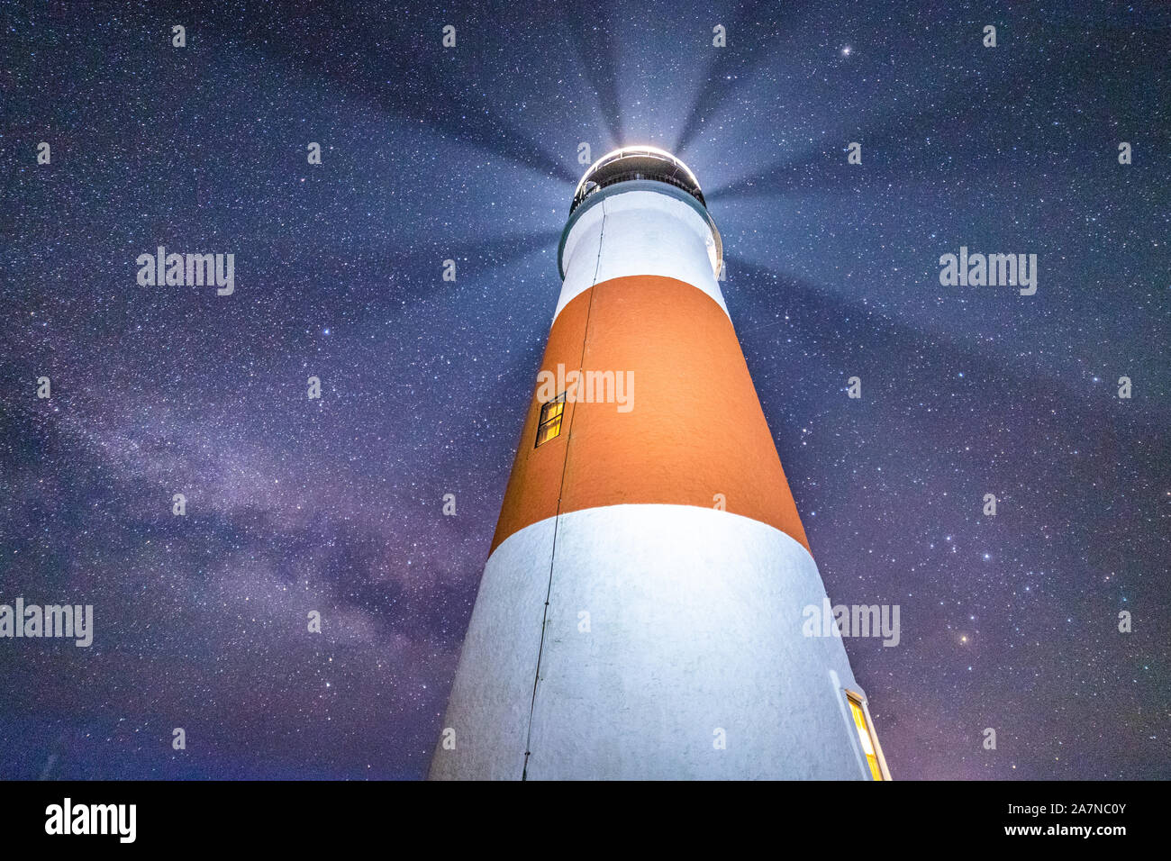Milky way galaxy stretching behind light house on Nantucket. Stock Photo