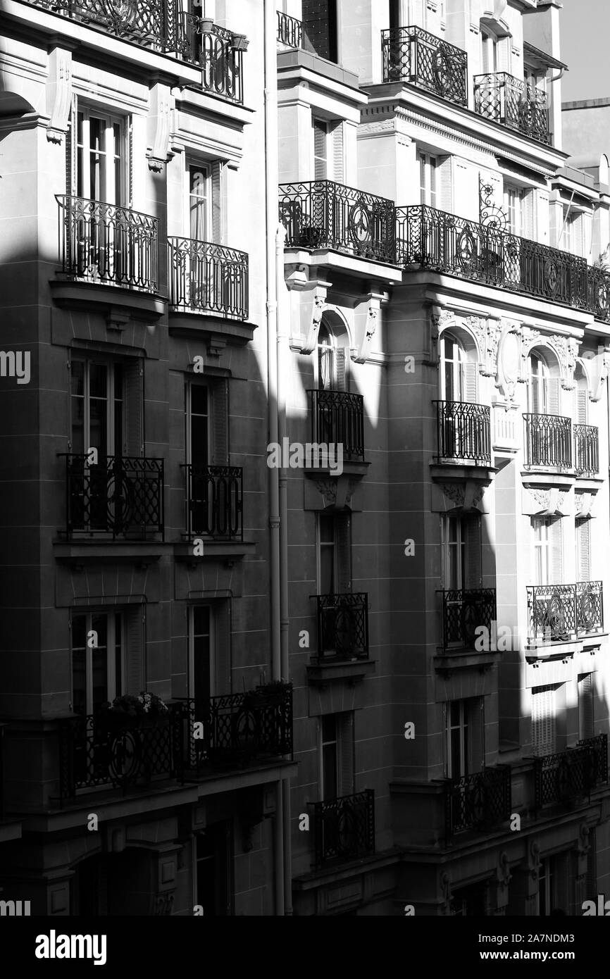 Classic French Building View. Parisian Architecture. Apartments with Large Windows and Balconies in Paris, France. Stock Photo