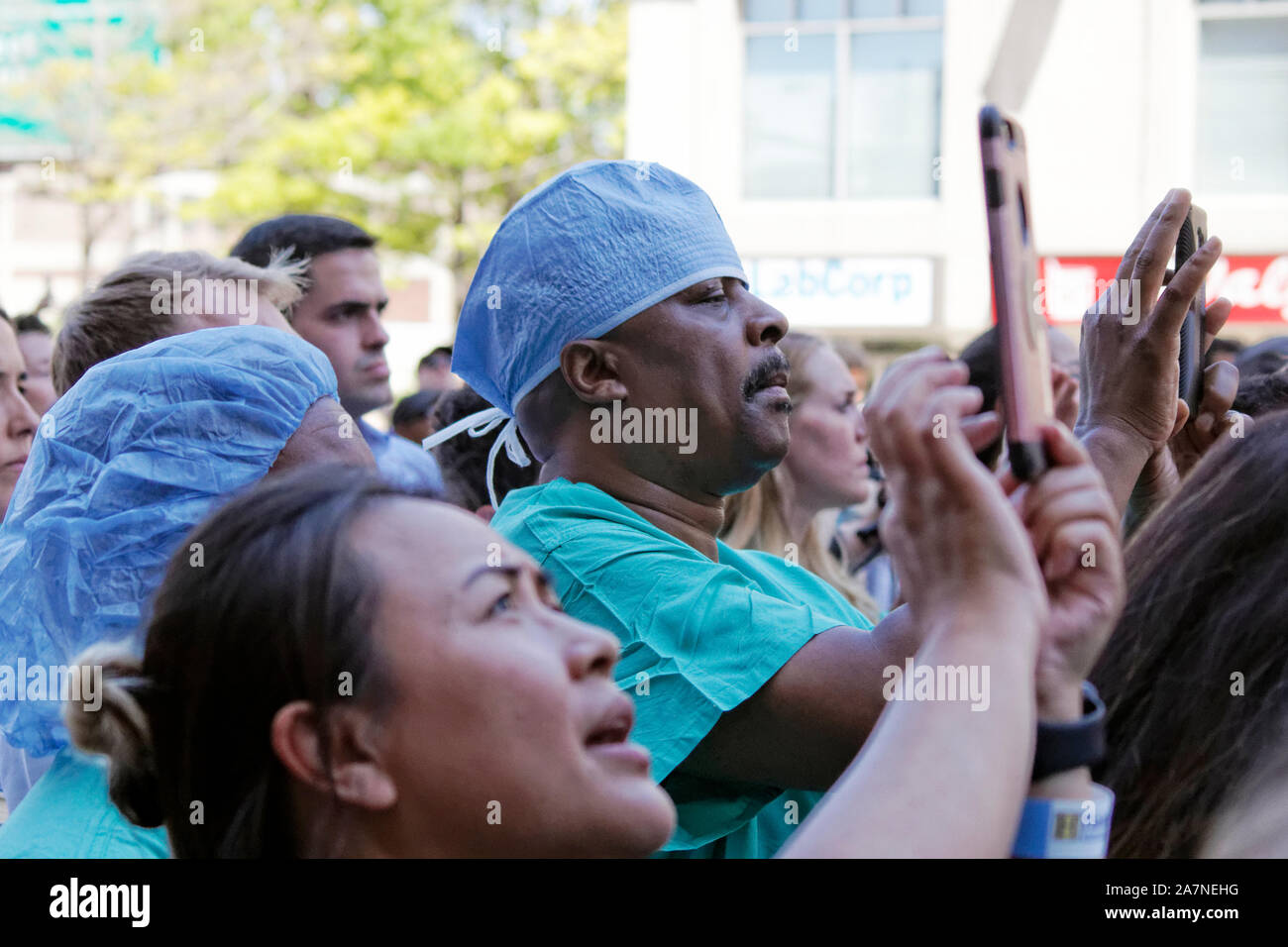 Philadelphia, PA, USA - July 15, 2019: 2020 Hospital staff use phones to record Presidential candidate Sen. Bernie Sanders' speech during a rally. Stock Photo