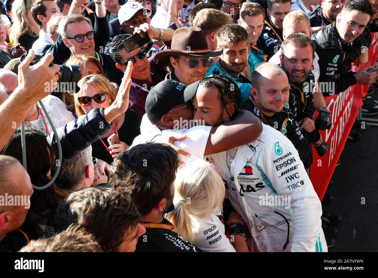 Austin, United States Of America. 03rd Nov, 2019. Motorsports: FIA Formula One World Championship 2019, Grand Prix of United States, #44 Lewis Hamilton (GBR, Mercedes AMG Petronas Motorsport) celebrates winning the F1 World Drivers Championship 2019 with his father Anthony Hamilton, Linda Hamilton and Matthew McConaughey | usage worldwide Credit: dpa/Alamy Live News Stock Photo