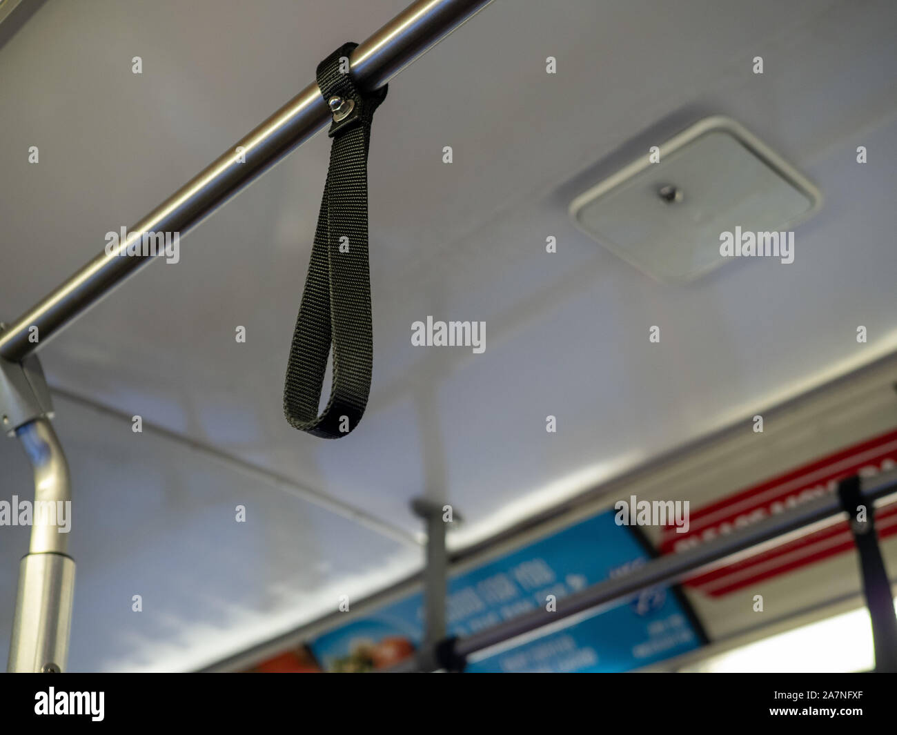 Hanging bus strap hi-res stock photography and images - Alamy