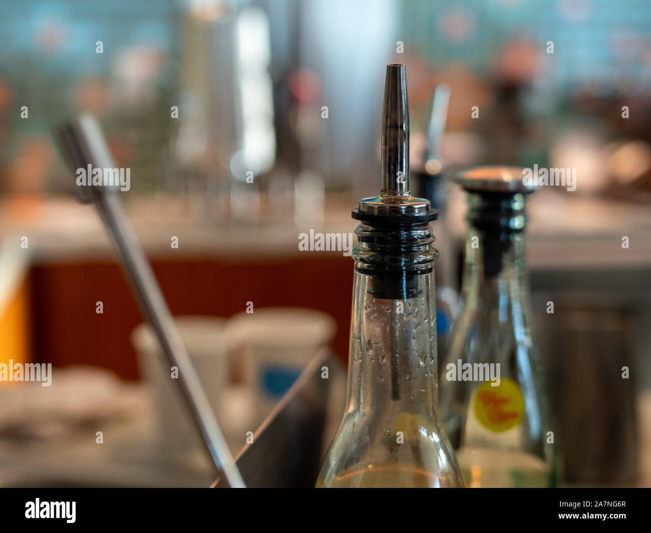 Nozzle of juice bottle sitting on counter of coffee shop Stock Photo