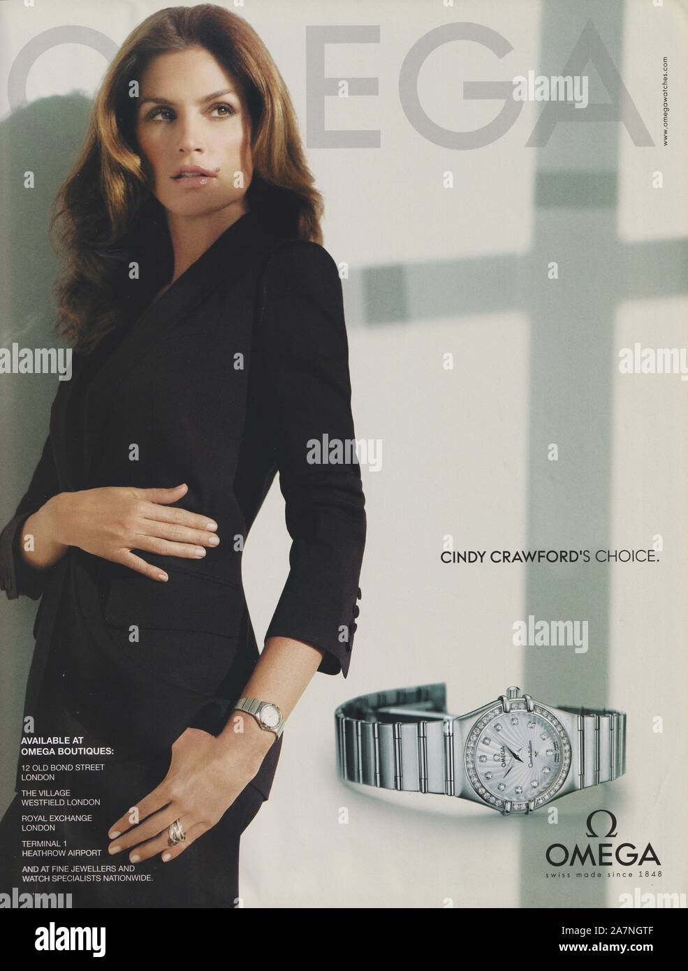 poster advertising OMEGA watch with Cindy Crawford in paper magazine from 2009 year, advertisement, creative OMEGA 2000s advert Stock Photo