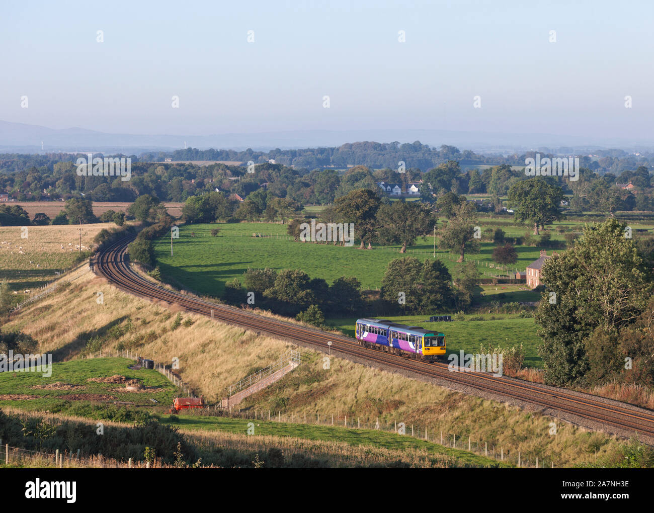 Arriva Northern rail class 142 pacer train passing How Mill on the Tyne valley line Stock Photo