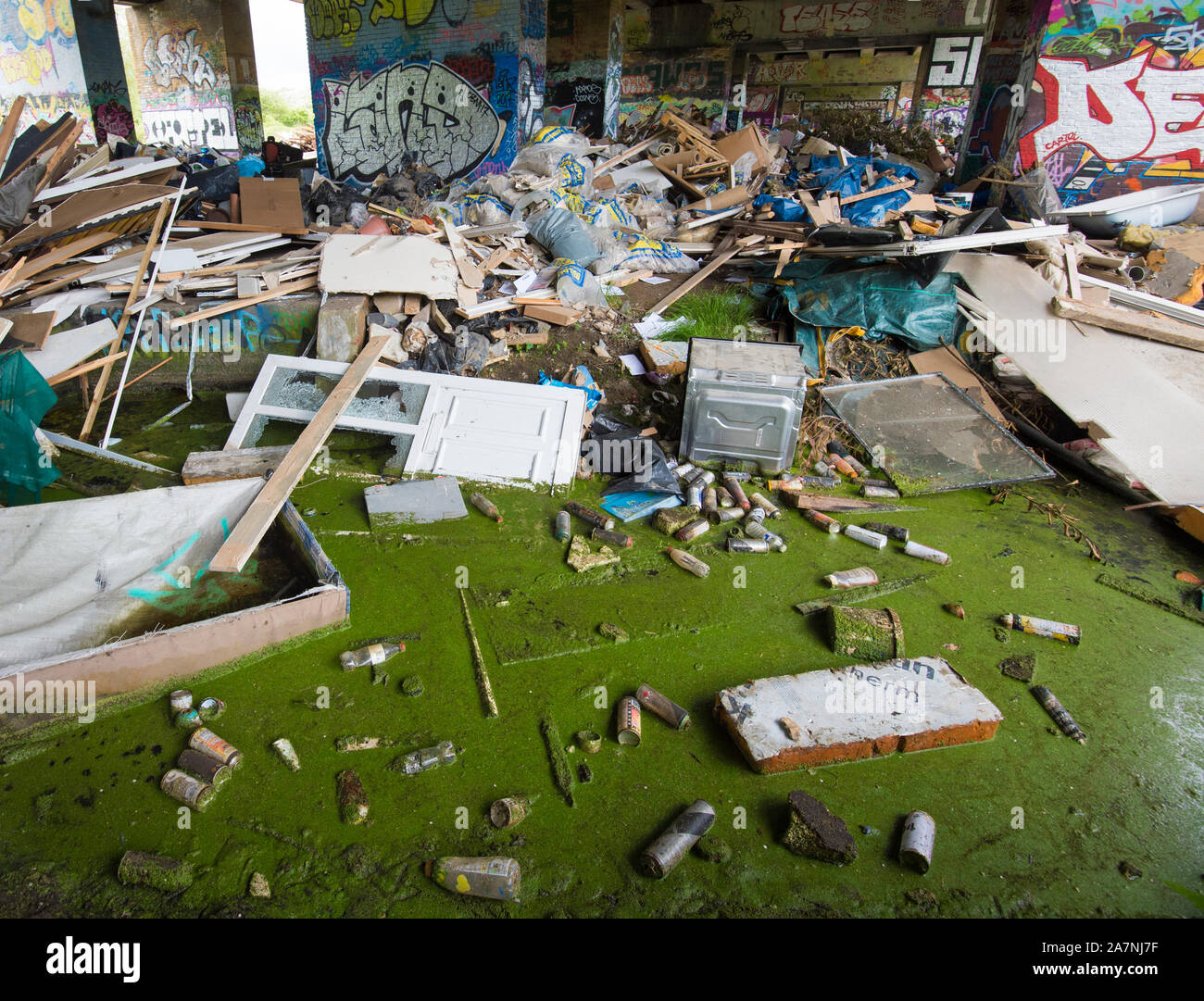 Up to 600 tonnes of rubbish has been 'fly-tipped' underneath the A40, near The Colne Valley Regional Park,  in Buckinghamshire. Stock Photo