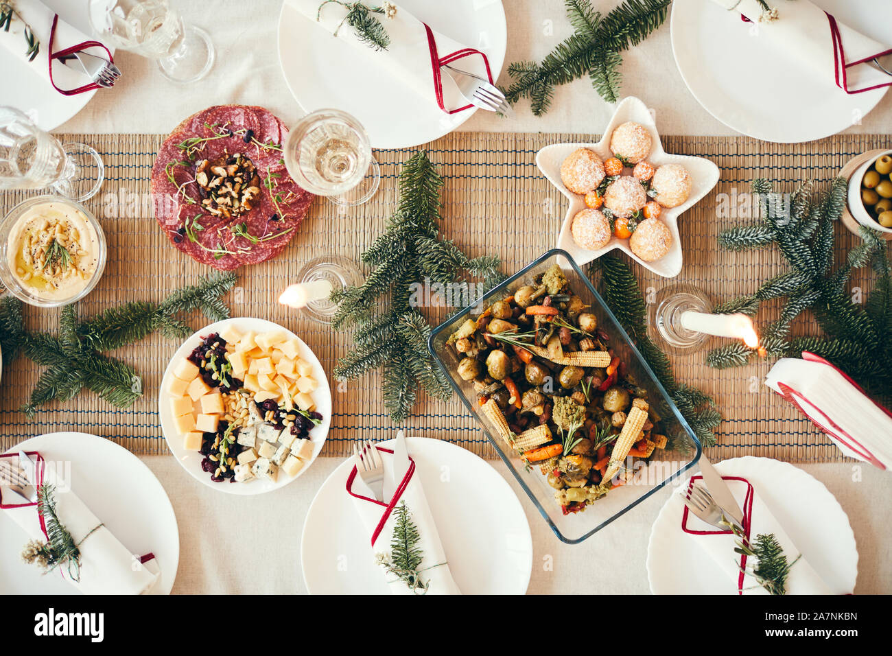Top view background of cozy table setting decorated with fir branches for Christmas  banquet focus on delicious homemade food, copy space Stock Photo - Alamy