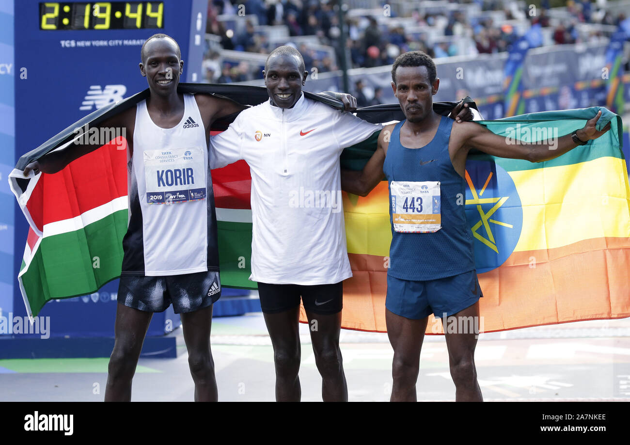 New York, United States. 03rd Nov, 2019. First place finisher Geoffrey Kamworor of Kenya stands with Albert Korir of Kenya and Girma Bekele Gebre of Ethiopia who took 2nd and 3rd place at 2019 NYRR TCS New York City Marathon in New York City on Sunday, November 3, 2019. Over 50,000 runners from New York City and around the world will race through the five boroughs on a course that winds its way from the Verrazano Bridge before crossing the finish line by Tavern on the Green in Central Park. Photo by John Angelillo/UPI Credit: UPI/Alamy Live News Stock Photo