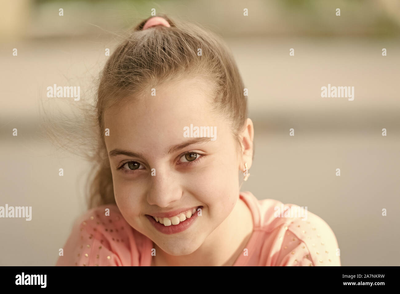 Enjoying The Beauty Of A Healthy Smile Cute Small Child With Long