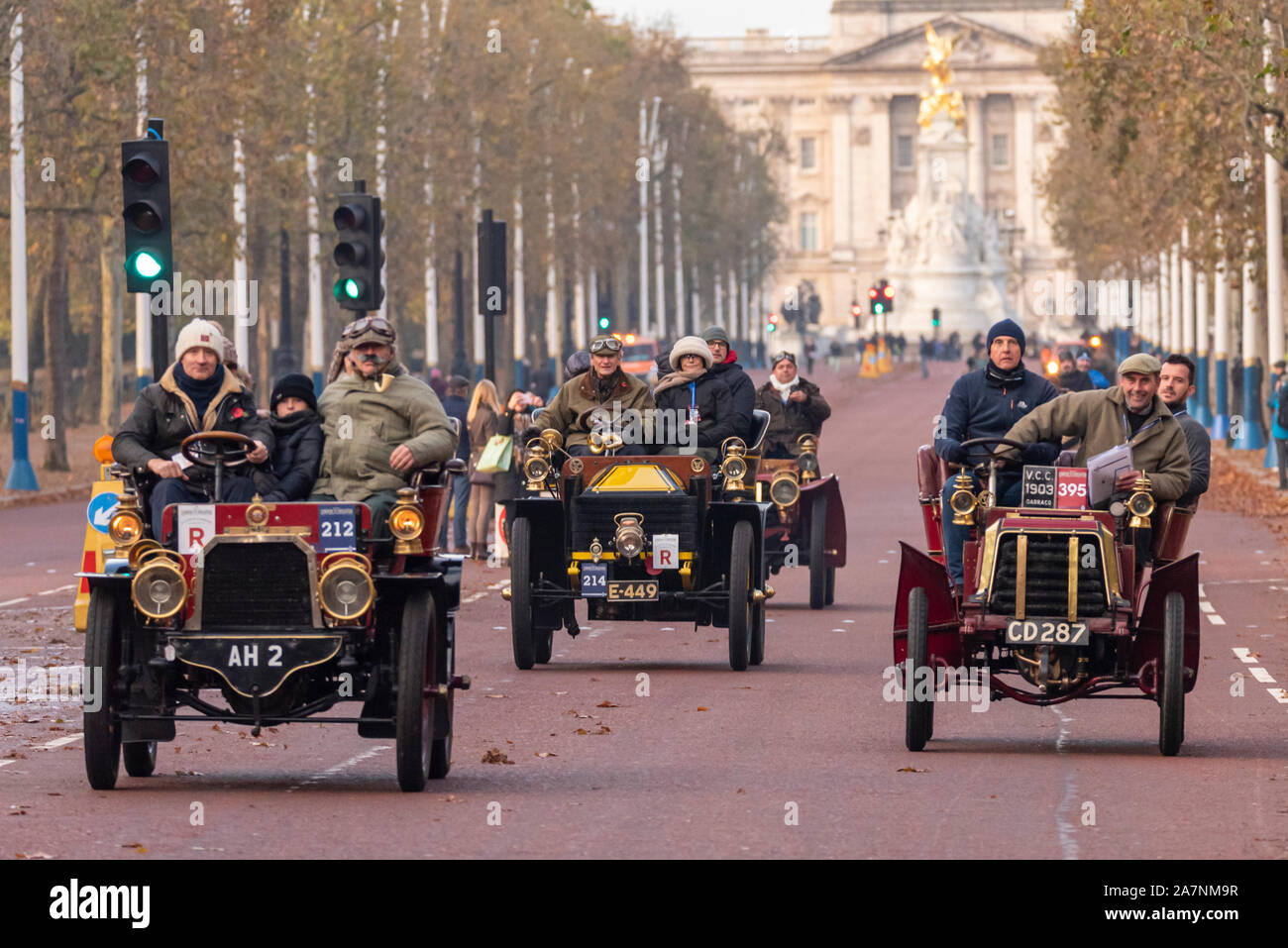 Vintage cars being driven down The Mall, Westminster, UK at the start of the London to Brighton veteran car run in November 2019. 1903 Gladiator Stock Photo