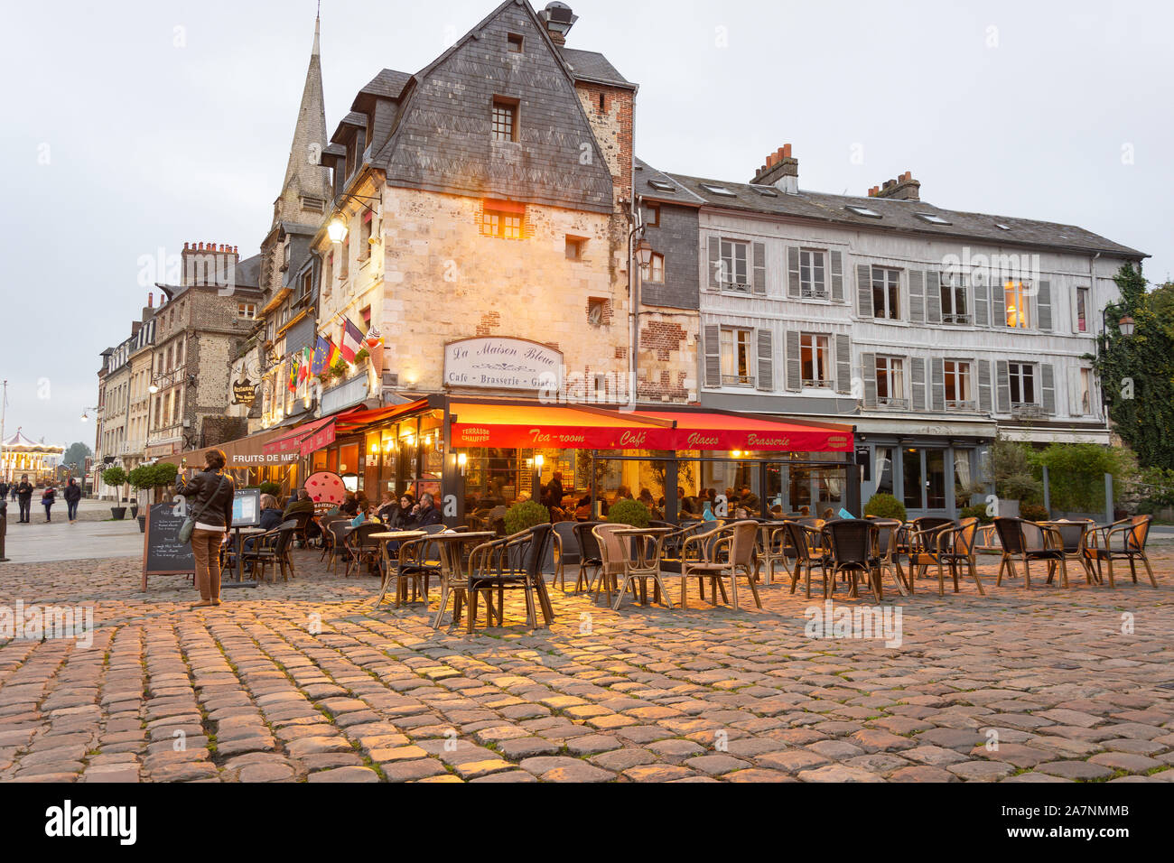 La Maison Bleu Cafe at dusk, Honfleur Harbour, Honfleur, Normandy, France Stock Photo