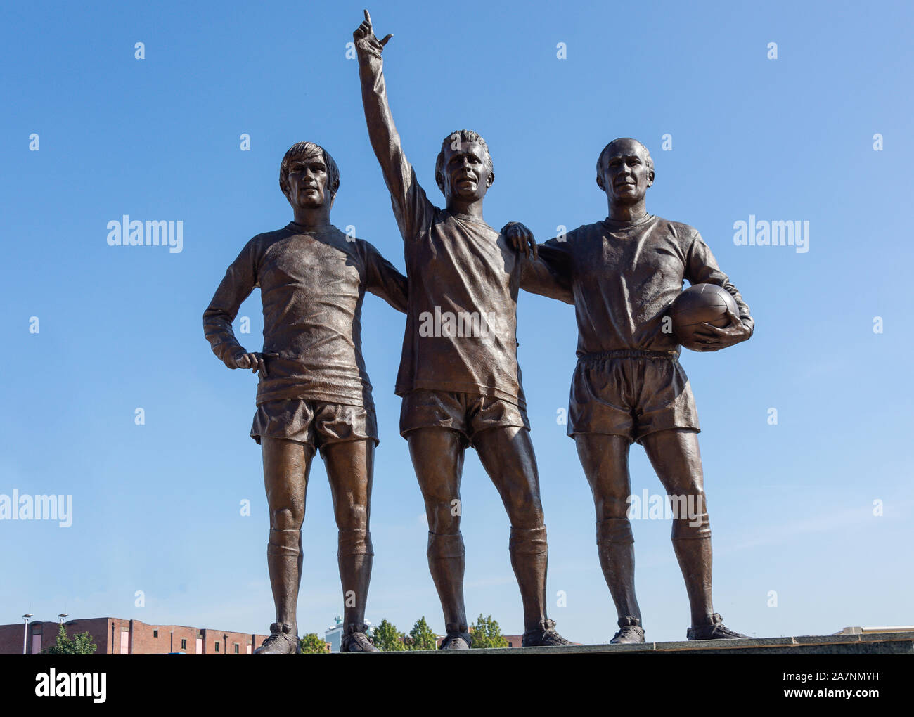 The United Trinity statue at entrance to Manchester United Old Trafford football ground, Trafford, Greater Manchester, England, United Kingdom Stock Photo