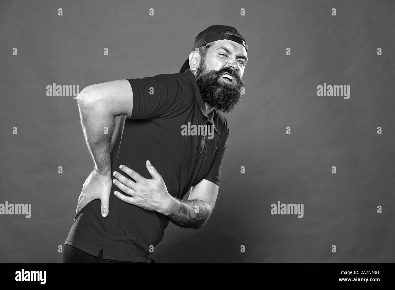 Guy feel pain in back. Healthcare and injuries concept. Sedentary