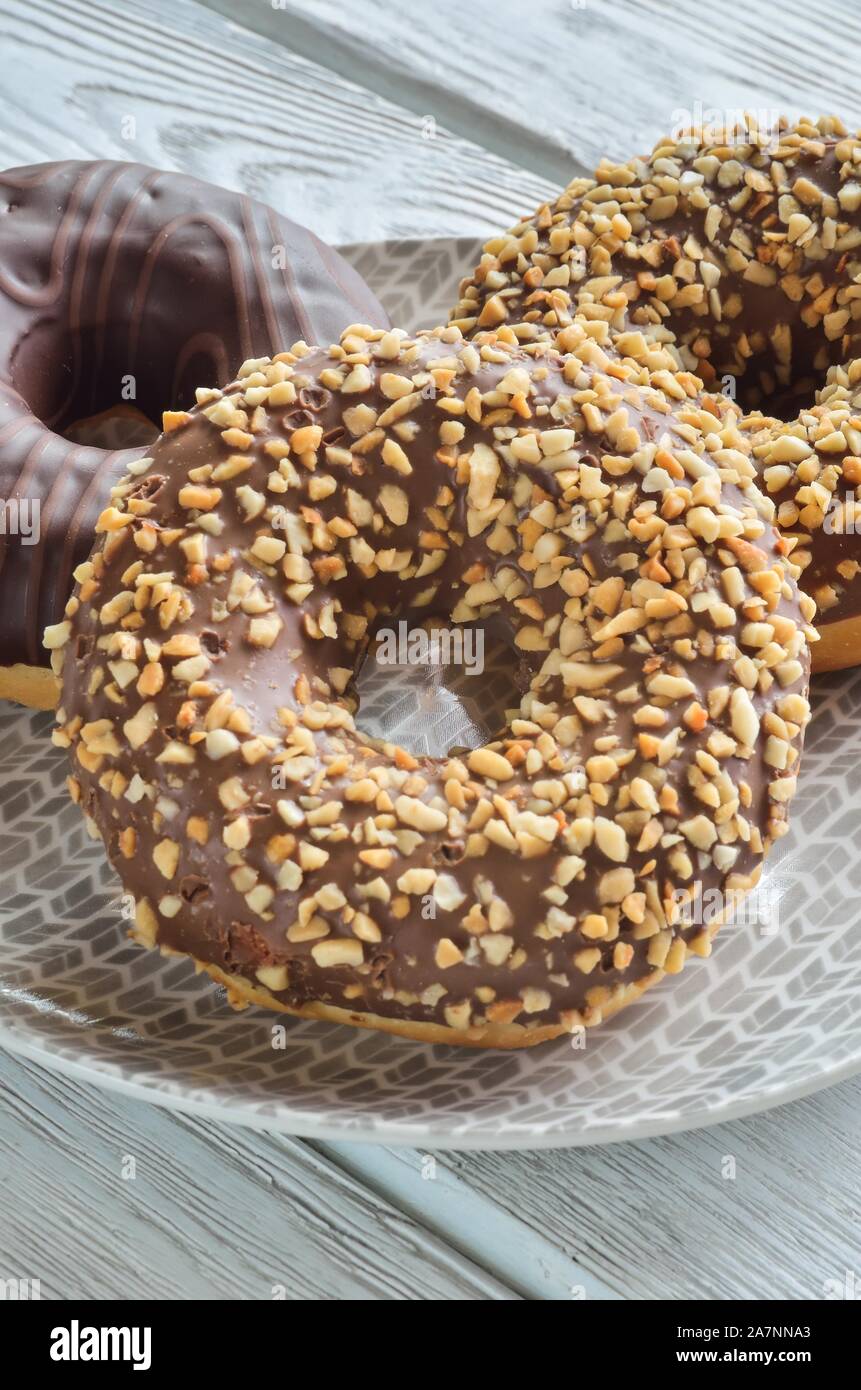 Sweet delicious dessert. Donut with a hole and with chocolate coating